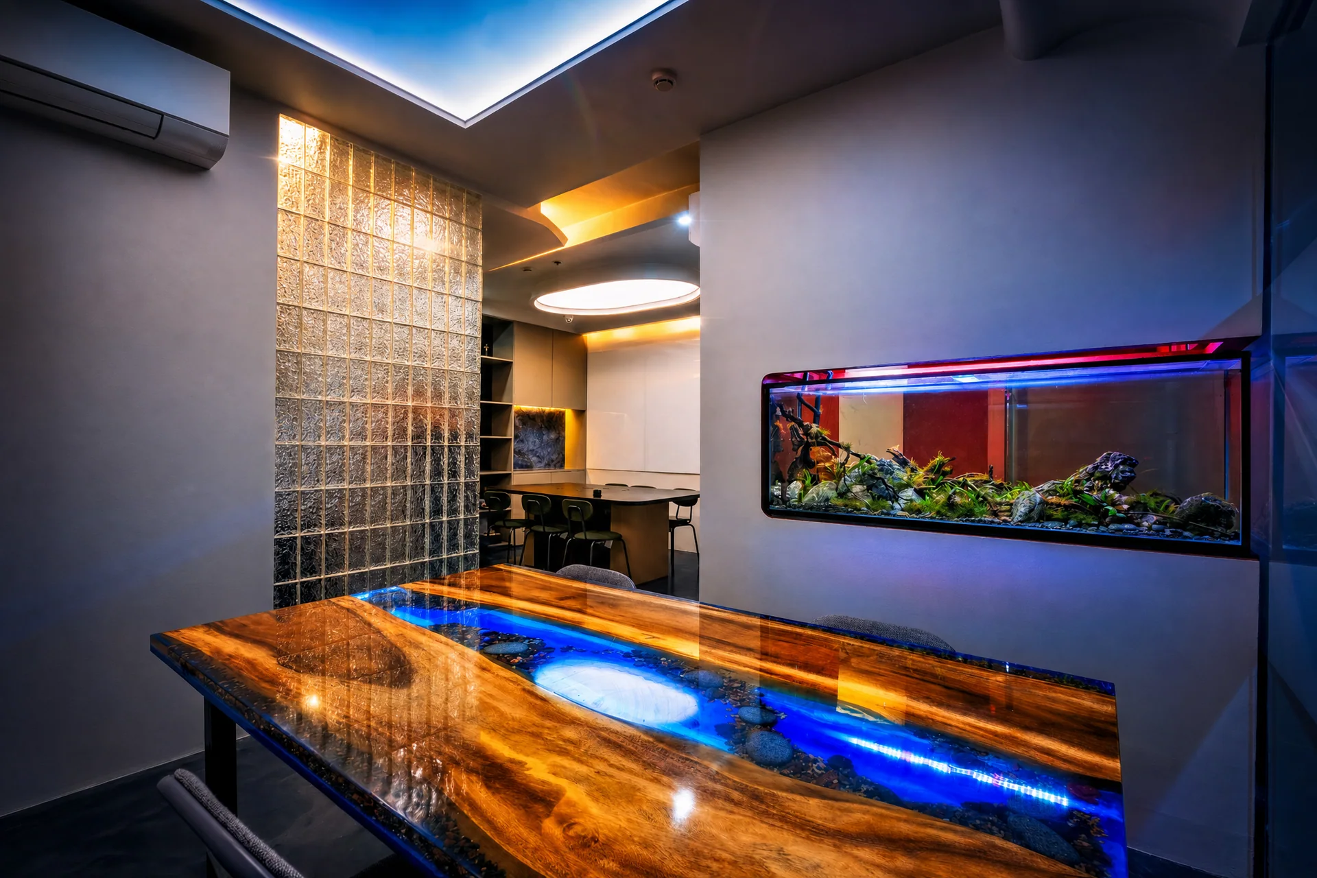 Resin river table beside an aquarium and glass-block partition